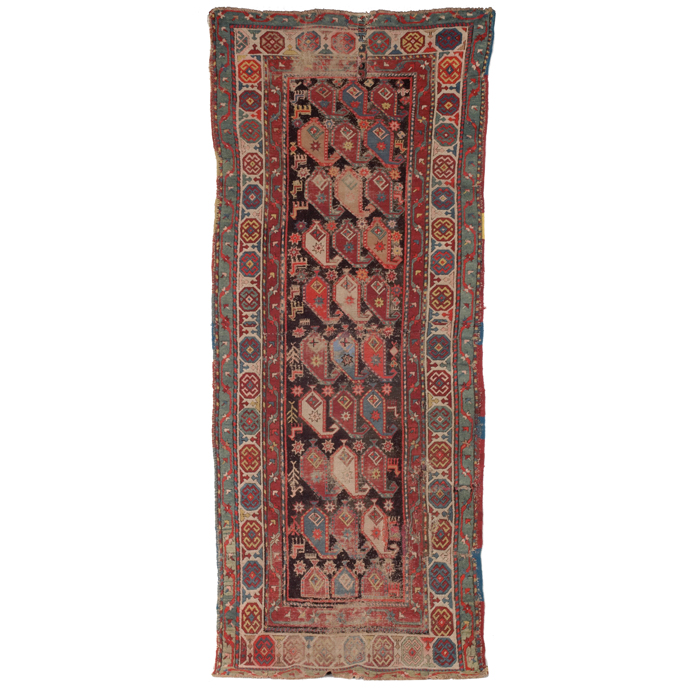 Appraisal: Caucasian rug c stylized floral and animal design on a