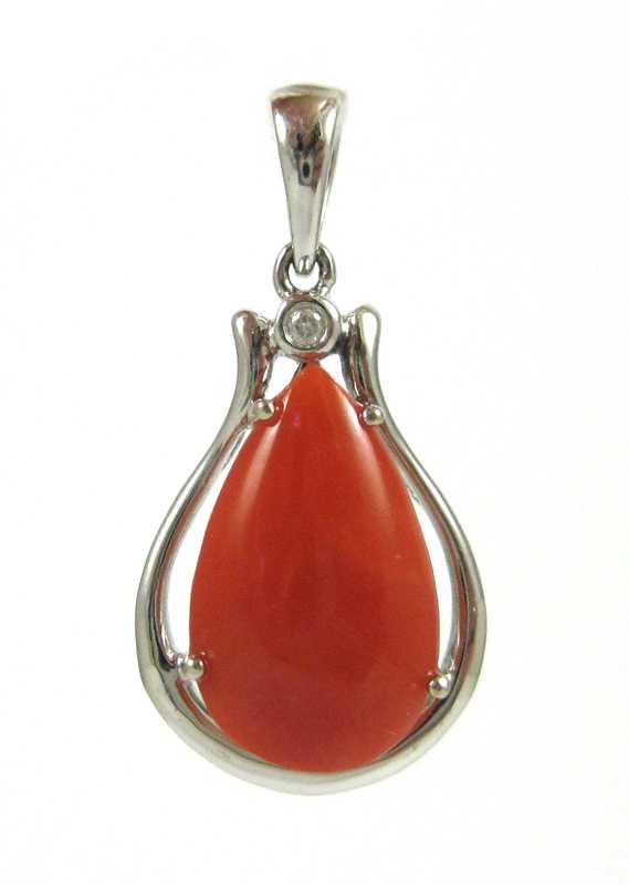 Appraisal: FOURTEEN KARAT WHITE GOLD DIAMOND AND CORAL PENDANT single round-cut