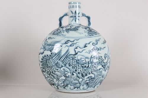 Appraisal: A CHINESE DUO-HANDLED BLUE AND WHITE DRAGON-DECORATING A Chinese Duo-handled