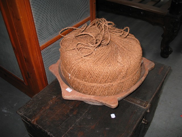 Appraisal: A wooden parat or grain sorting bowl together with a