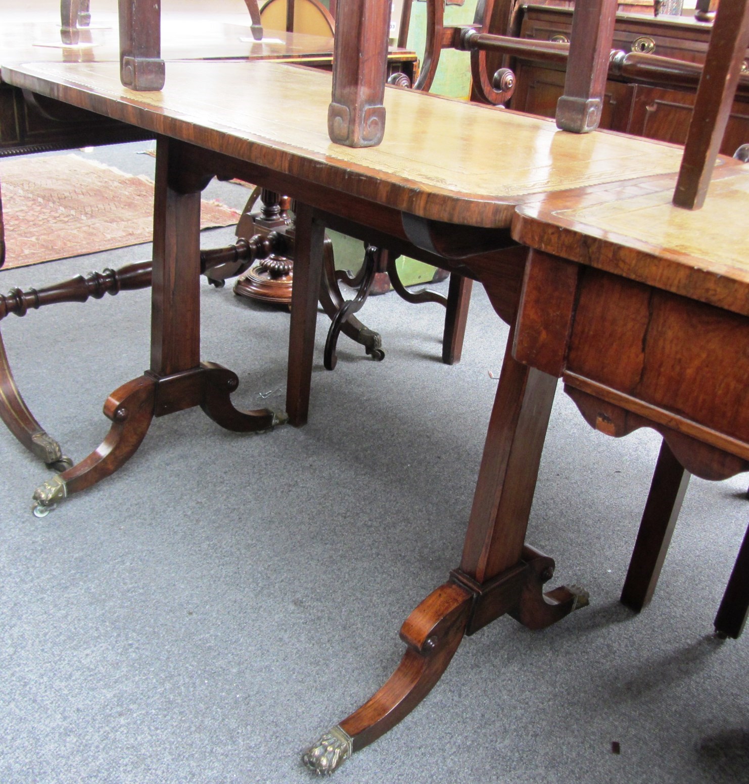 Appraisal: An early th century rosewood centre table with rectangular leather