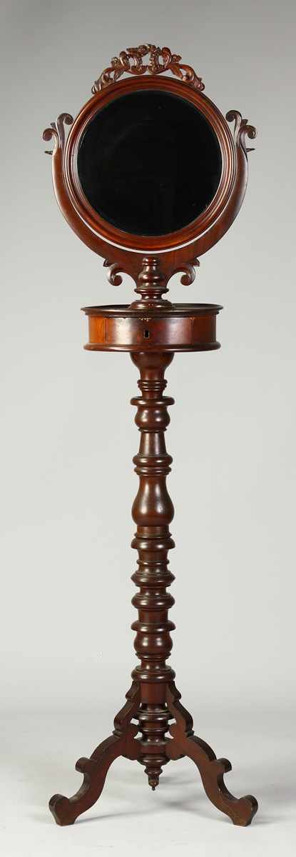 Appraisal: Victorian Walnut Shaving Stand th cent Turned base carved crest