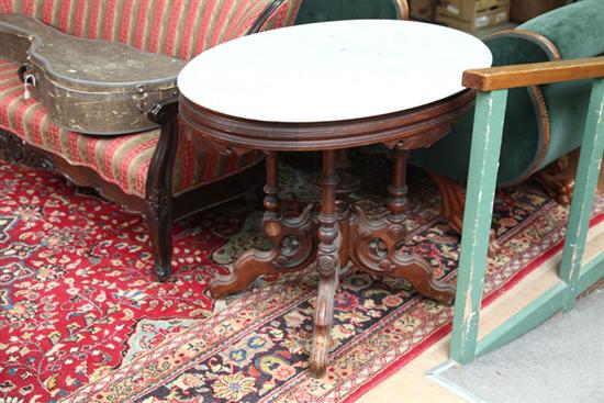 Appraisal: VICTORIAN PARLOR TABLE Oval marble top on a conforming walnut