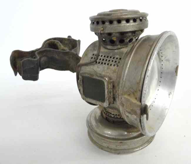 Appraisal: Twentieth Century oil head lamp with bracket