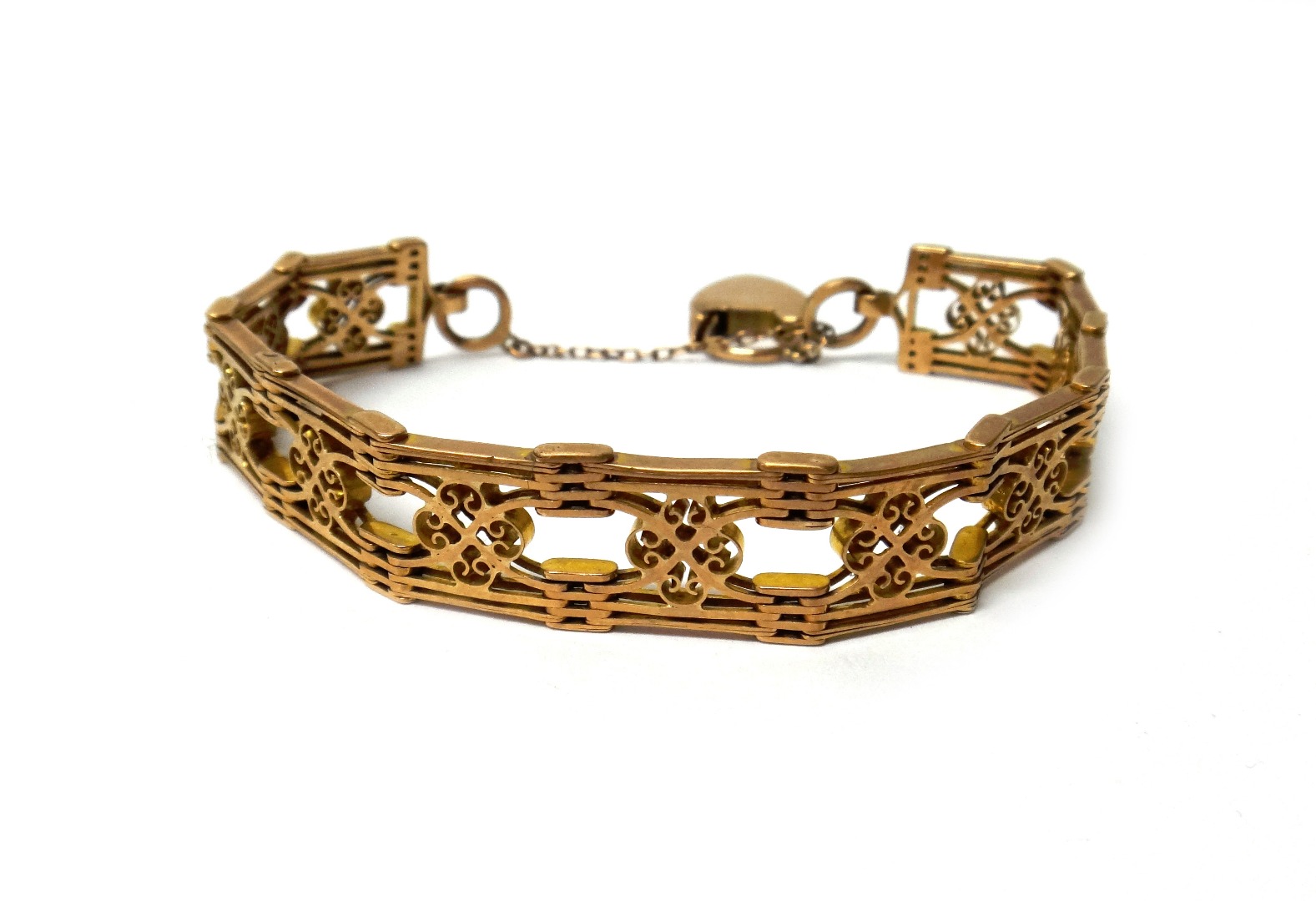 Appraisal: A gold bracelet in a wide multiple bar and pierced