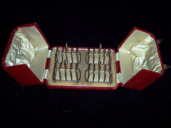 Appraisal: Four miniature toast racks each with ring handle Chester in