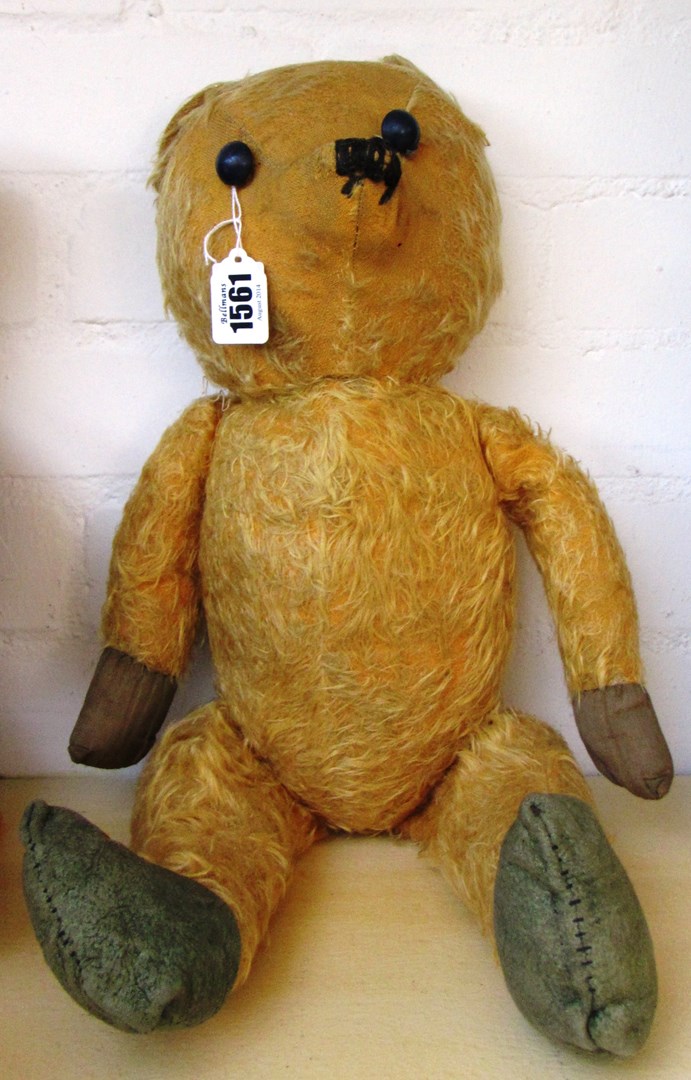 Appraisal: A vintage teddy bear mid th century with orange fur