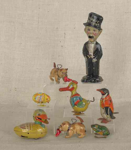 Appraisal: Eight tin litho wind-up toys th c to include Marx