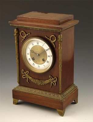 Appraisal: A French mahogany and brass mounted mantel clock having an