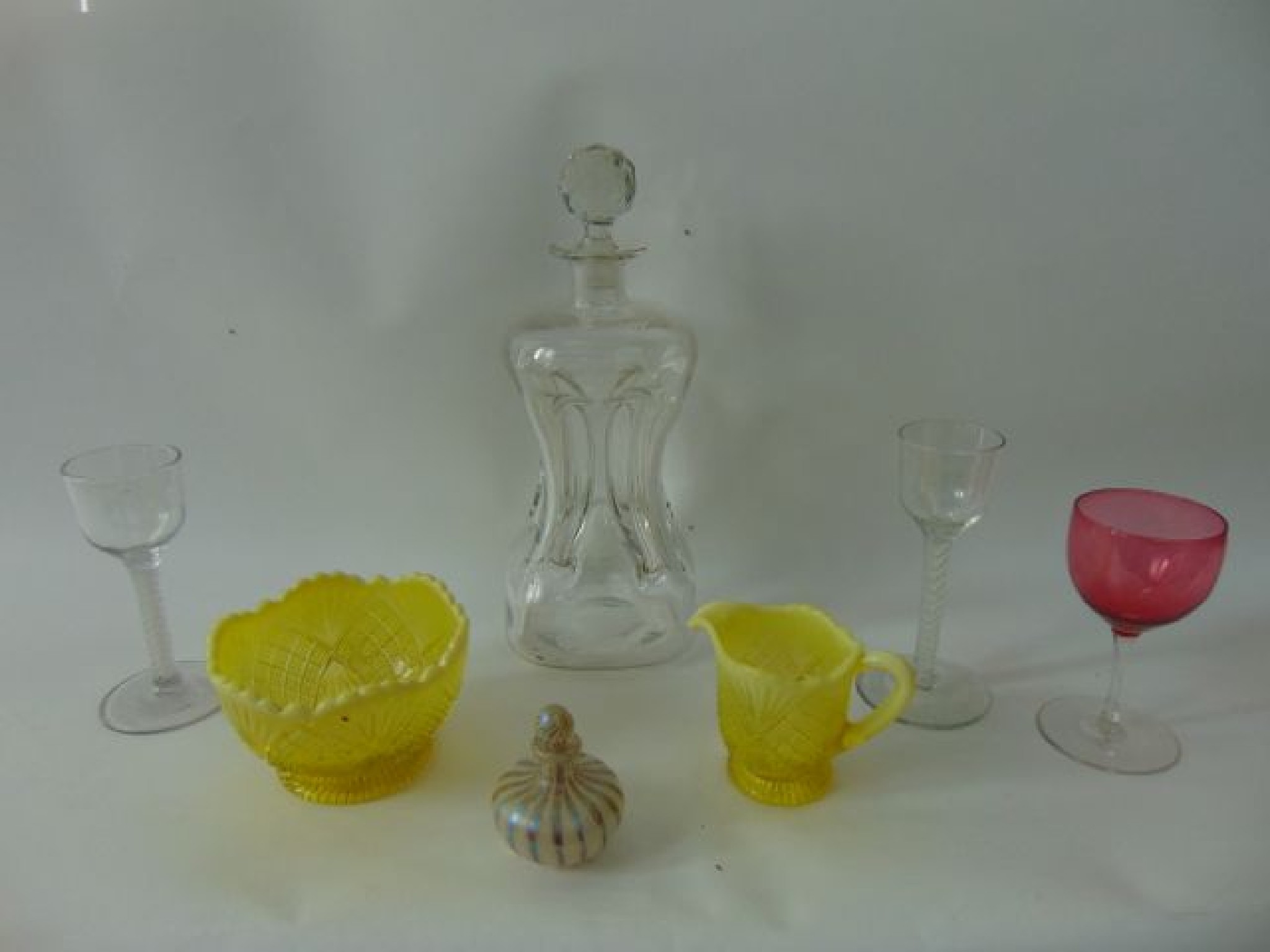 Appraisal: A decanter and stopper of four sided form with pinched