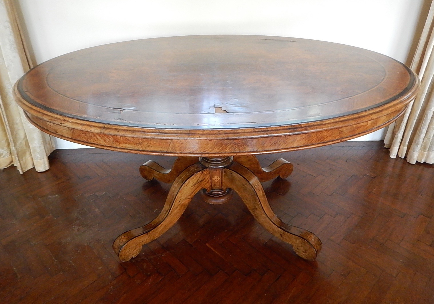 Appraisal: A Victorian walnut oval loo table with quarter veneered top