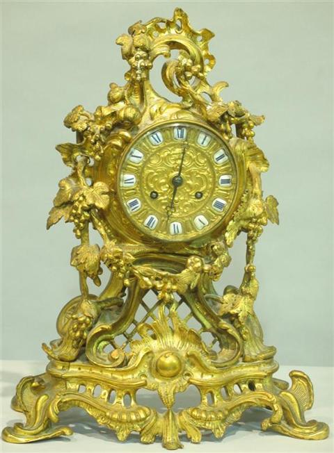 Appraisal: LOUIS XV STYLE GILT BRONZE MANTEL CLOCK The circular clock