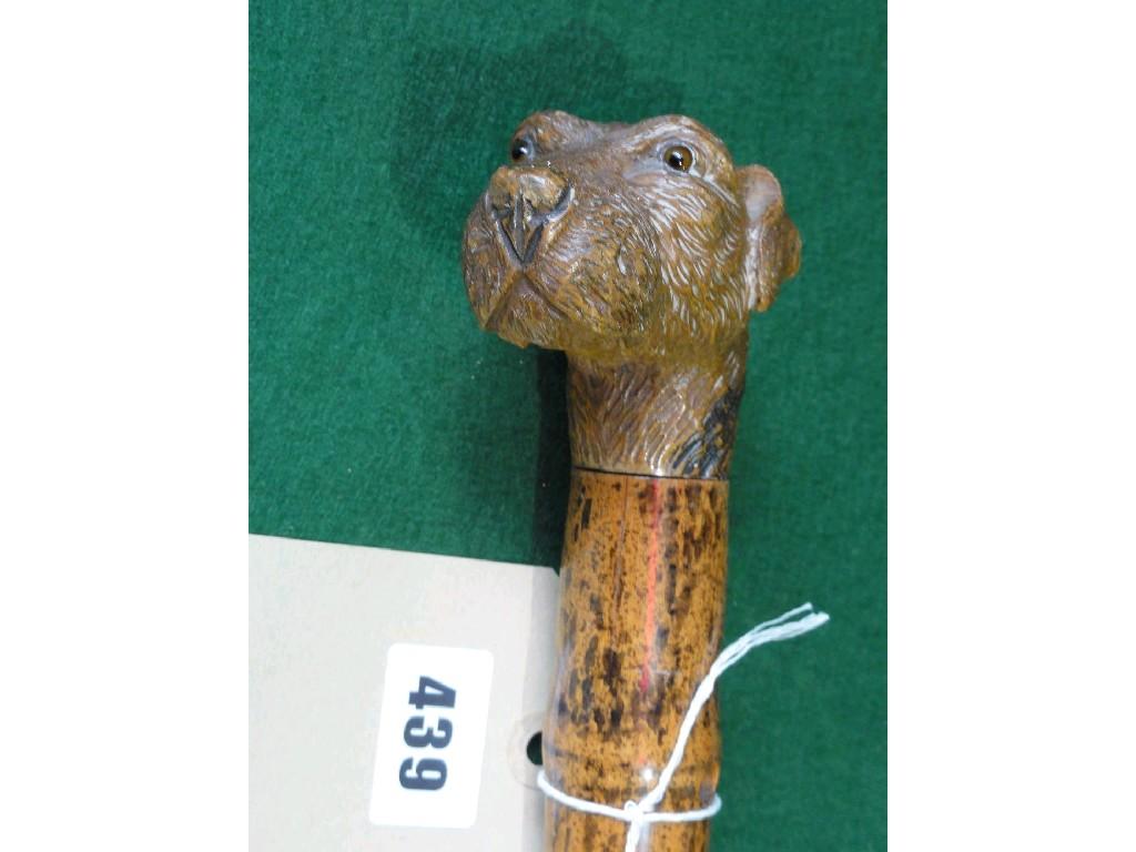 Appraisal: A ladies umbrella with a carved terriers head to the