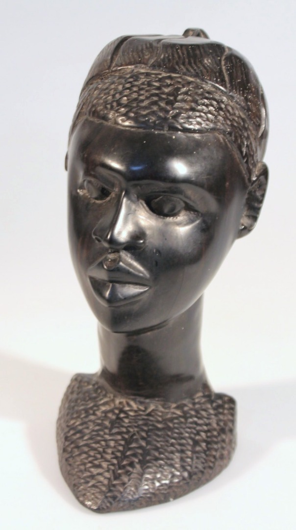 Appraisal: A thC African tribal hardwood head carved as a figure