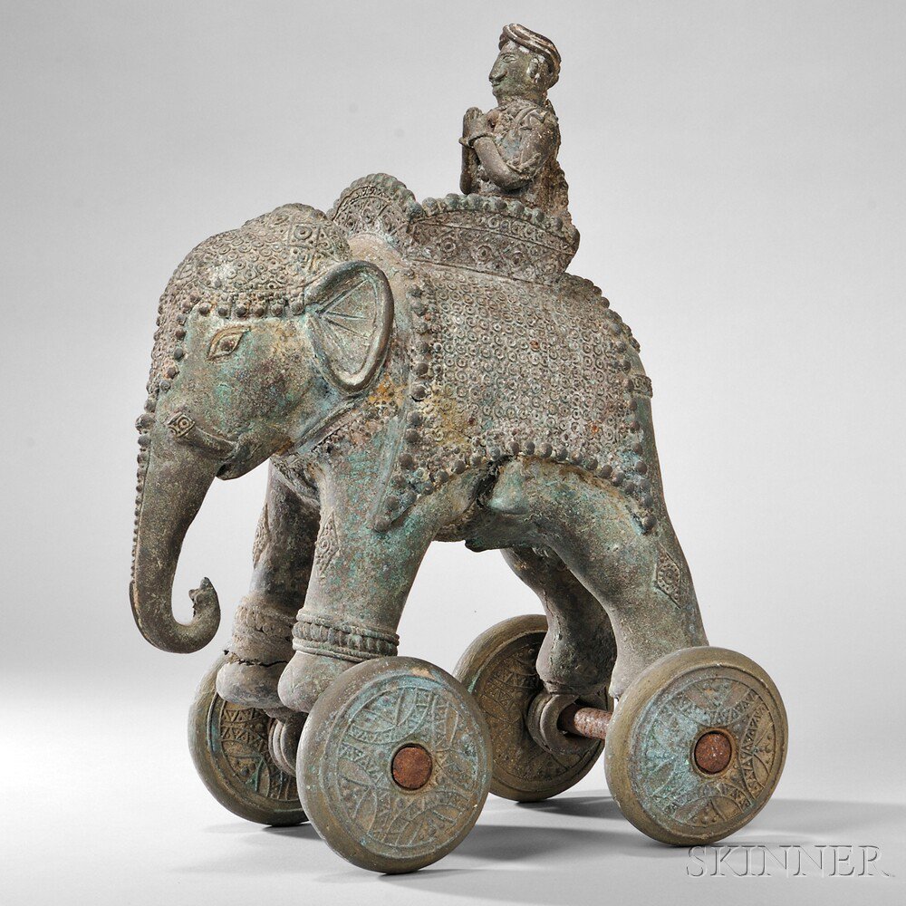 Appraisal: Bronze Toy Elephant on Wheels India a male rider seated