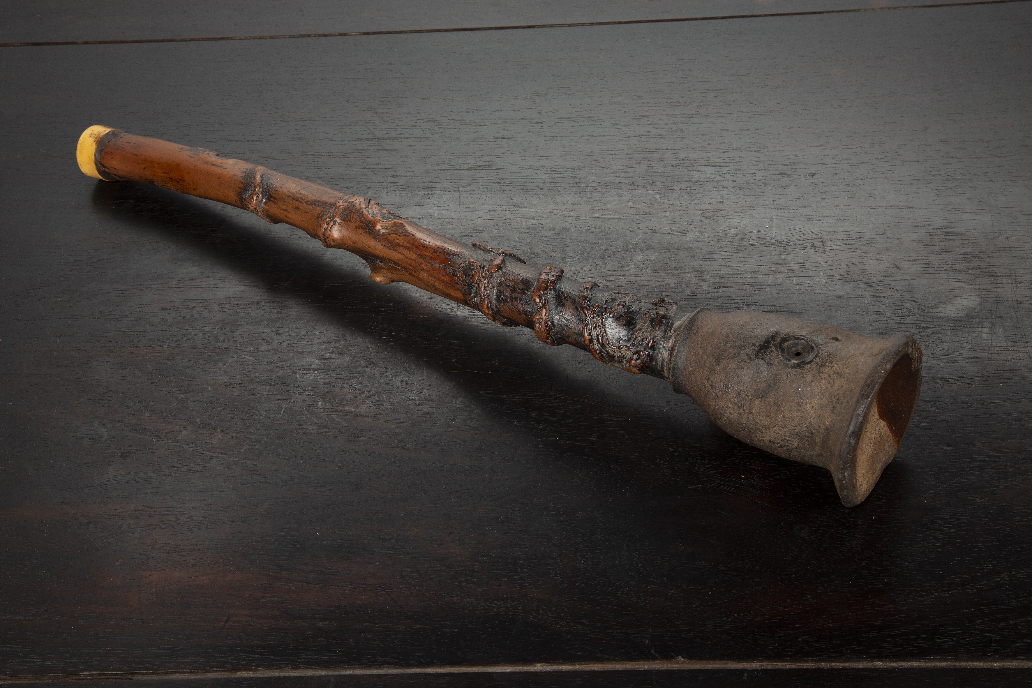 Appraisal: Rustic Hmong opium pipeVietnam late th Century with a bone