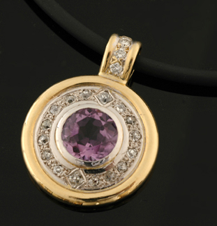 Appraisal: An amethyst and diamond pendant The circular ct two tone