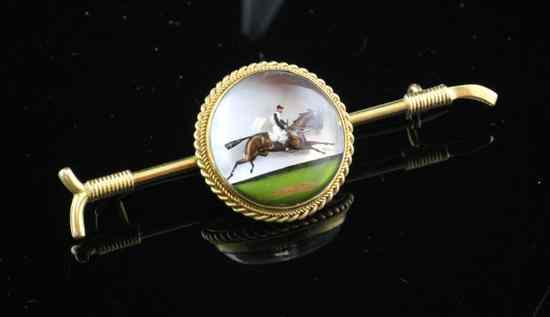 Appraisal: An Edwardian gold and Essex crystal equestrian brooch decorated with