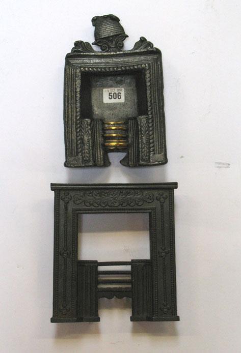 Appraisal: A CAST LEAD MINIATURE FIREPLACE with decorative surmount of a