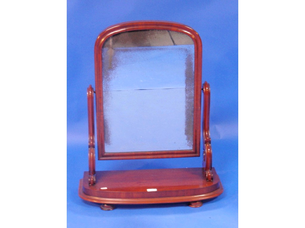 Appraisal: A Victorian mahogany dressing table mirror with scroll supports and