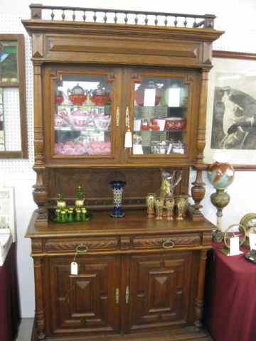 Appraisal: Carved Oak Cupboard double glassdoors over serving area and solid