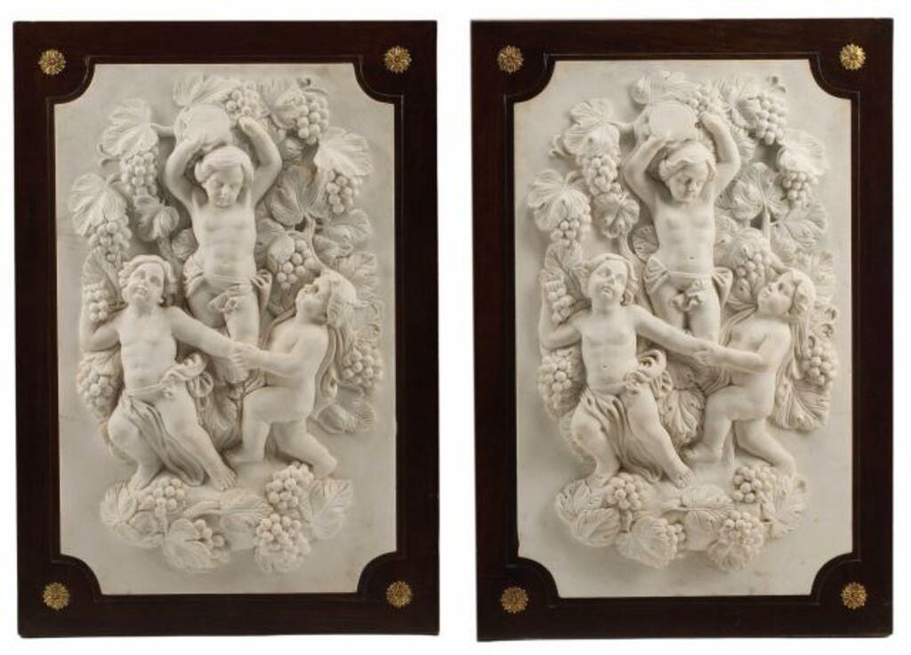 Appraisal: pair Framed marble plaques with bacchanalian putti typical chips around