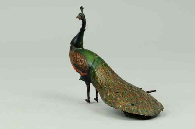 Appraisal: MECHANICAL WALKING PEACOCK Ebo Germany lithographed tin colorful peacock toy