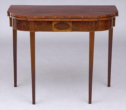 Appraisal: FEDERAL MAHOGANY GAMES TABLE The bowed breakfront folding top rising