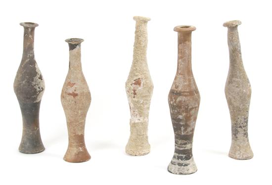 Appraisal: A Collection of Five Near East Earthenware Unguentariums Height of