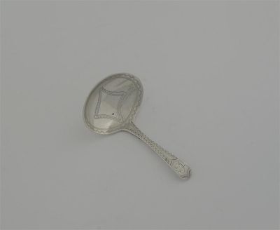 Appraisal: A George III caddy spoon with engraved bowl and handle