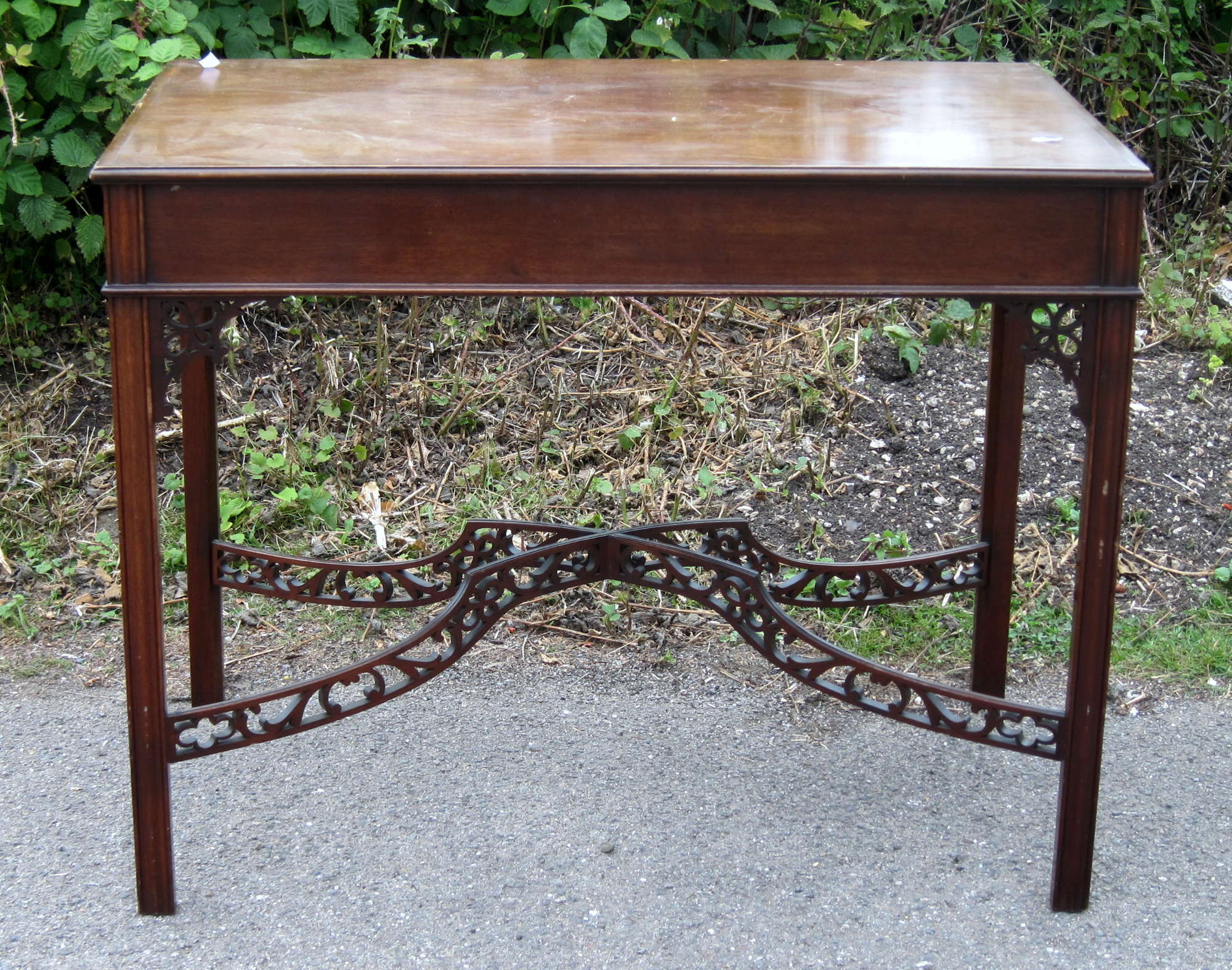 Appraisal: th century mahogany side table with fretwork X-frame cm x