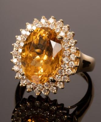 Appraisal: A citrine and diamond cocktail ring the large oval citrine