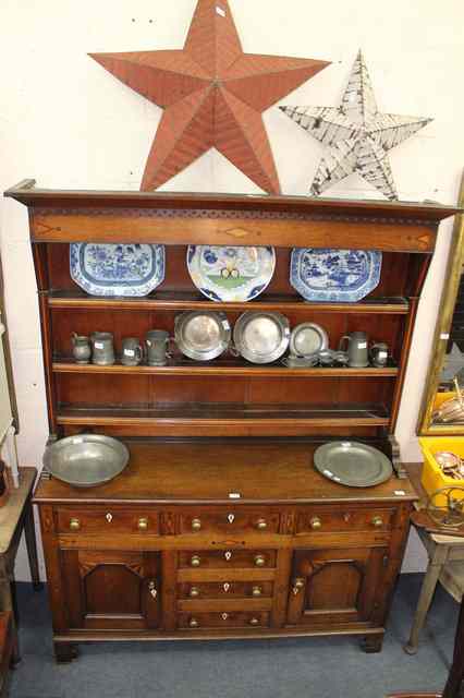 Appraisal: A GEORGE III OAK DRESSER the upper part with cavetto