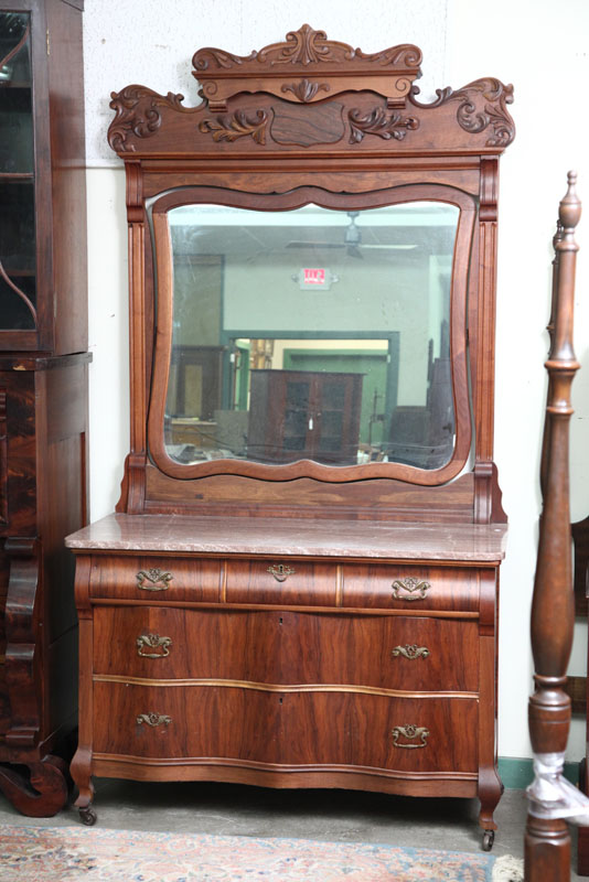 Appraisal: MARBLE TOP DRESSER WITH MIRROR Walnut with applied carved crest