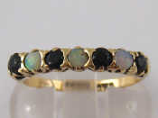 Appraisal: A carat gold sapphire and opal ring size N gms