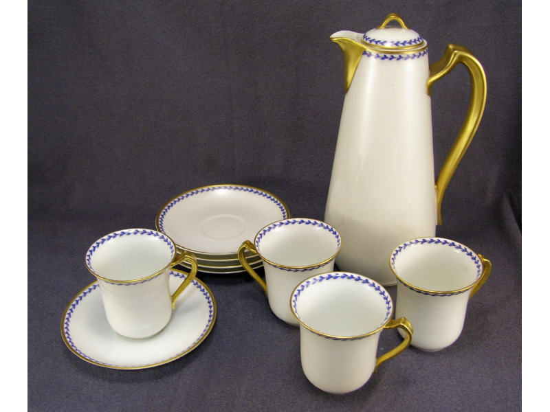 Appraisal: Haviland Limoges Chocolate Set White porcelain with small cobalt laurel