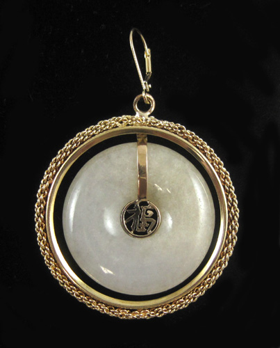 Appraisal: CHINESE WHITE JADE AND YELLOW GOLD PENDANT The k gold