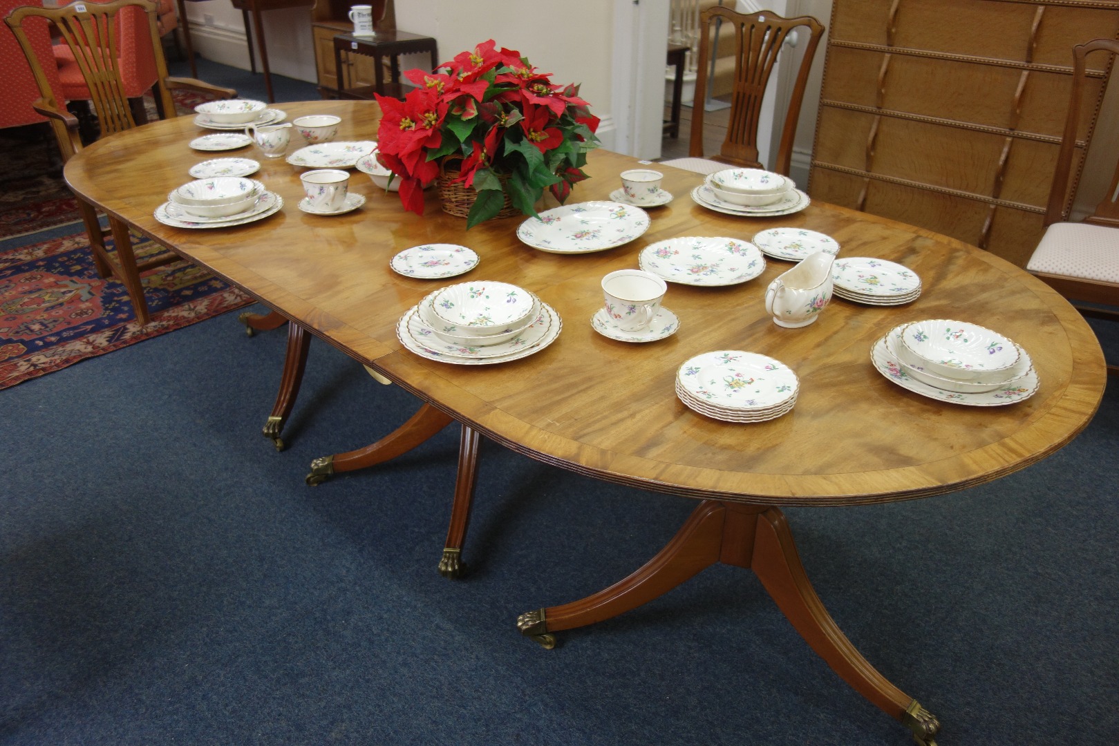 Appraisal: A reproduction Regency style mahogany and crossbanded 'D' end dining