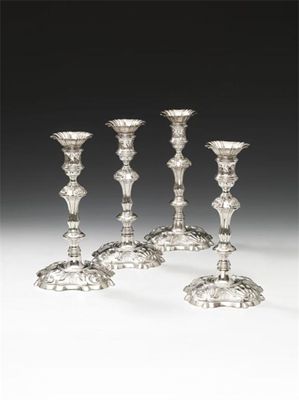 Appraisal: A set of four George II cast silver candlesticks by