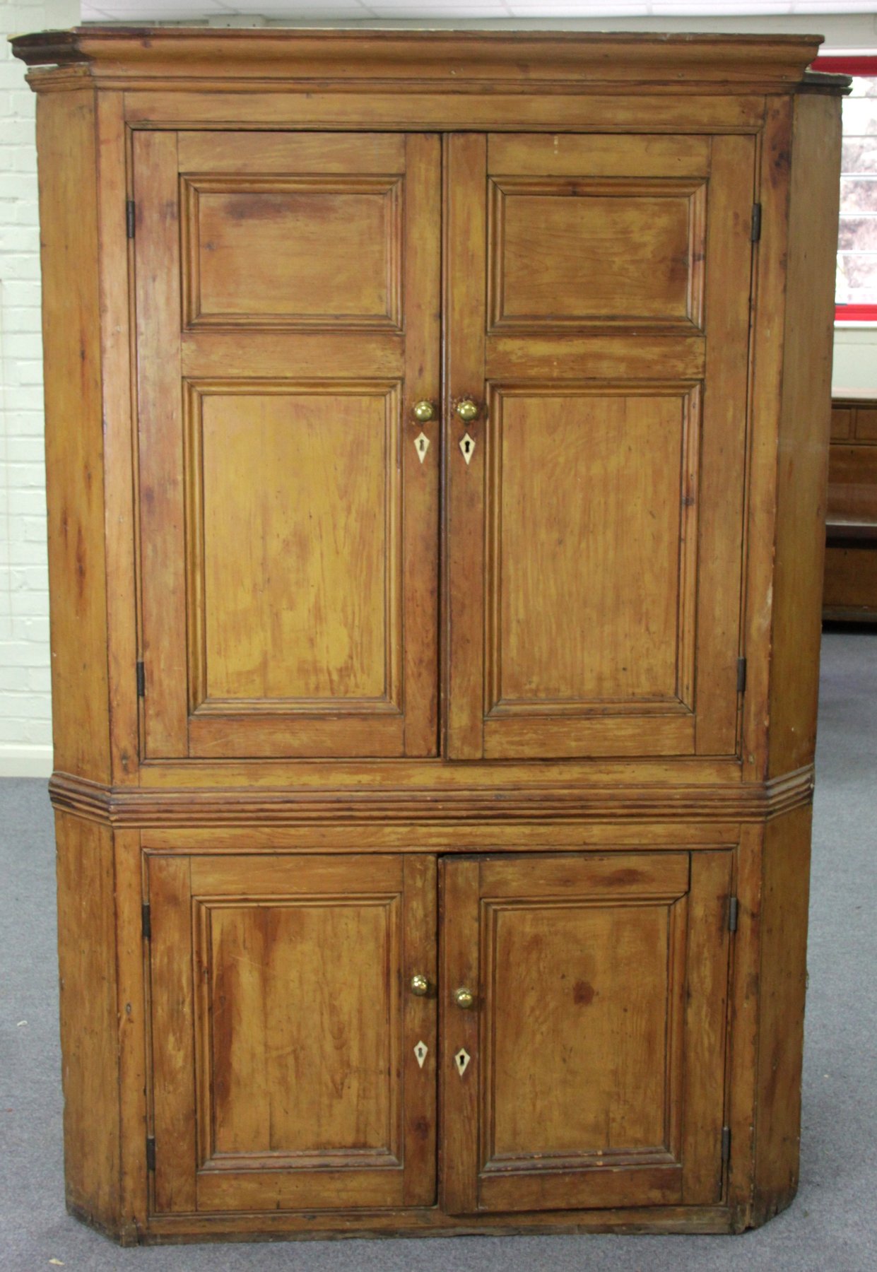 Appraisal: A th Century pine standing corner cupboard with panelled doors