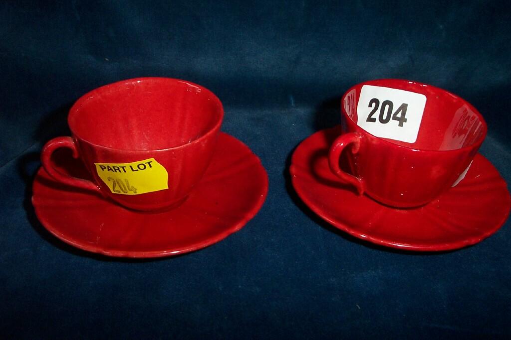 Appraisal: A pair of small Royal Doulton flambe cups and saucers