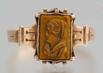 Appraisal: A Victorian Tiger Eye Cameo Ring Unmarked yellow gold band