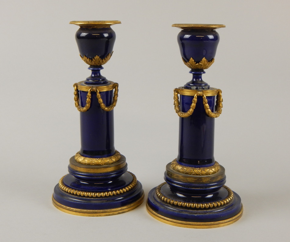 Appraisal: A pair of thC Continental porcelain candlesticks each with gilt