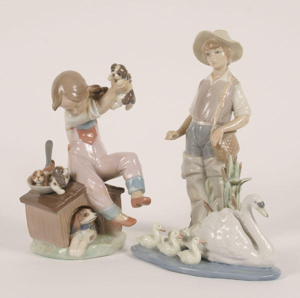 Appraisal: Lladro figures floating swan with babies little girl with puppies