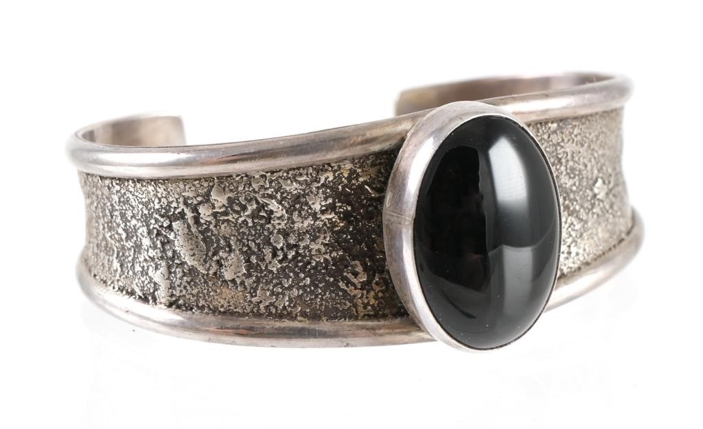 Appraisal: Sterling silver bracelet by Yazzie with oval onyx stone about