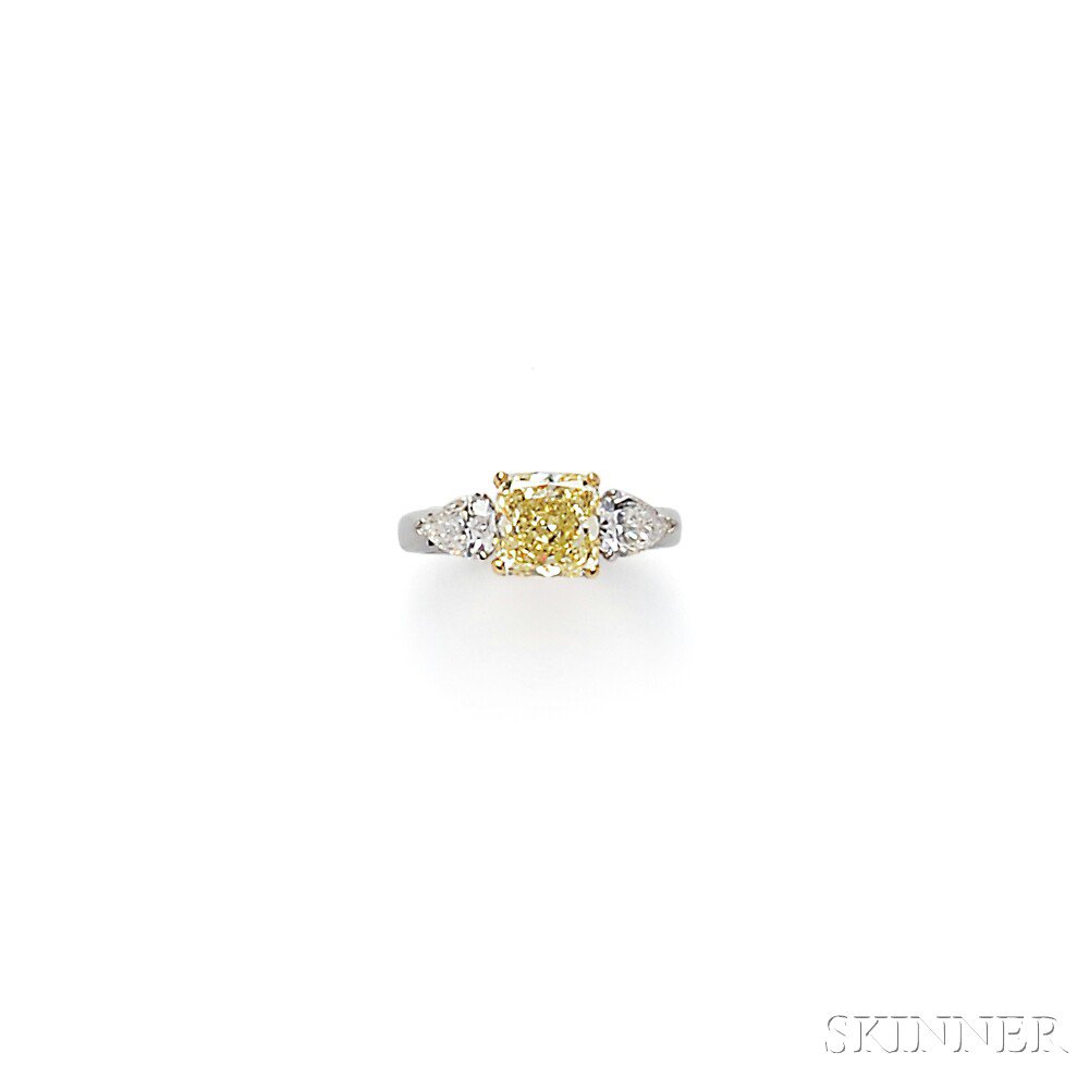 Appraisal: Platinum and Colored Diamond Solitaire prong-set with a cushion-cut fancy