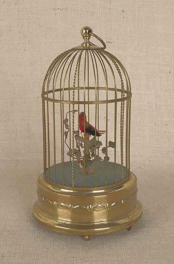 Appraisal: German singing bird in a cage th c h