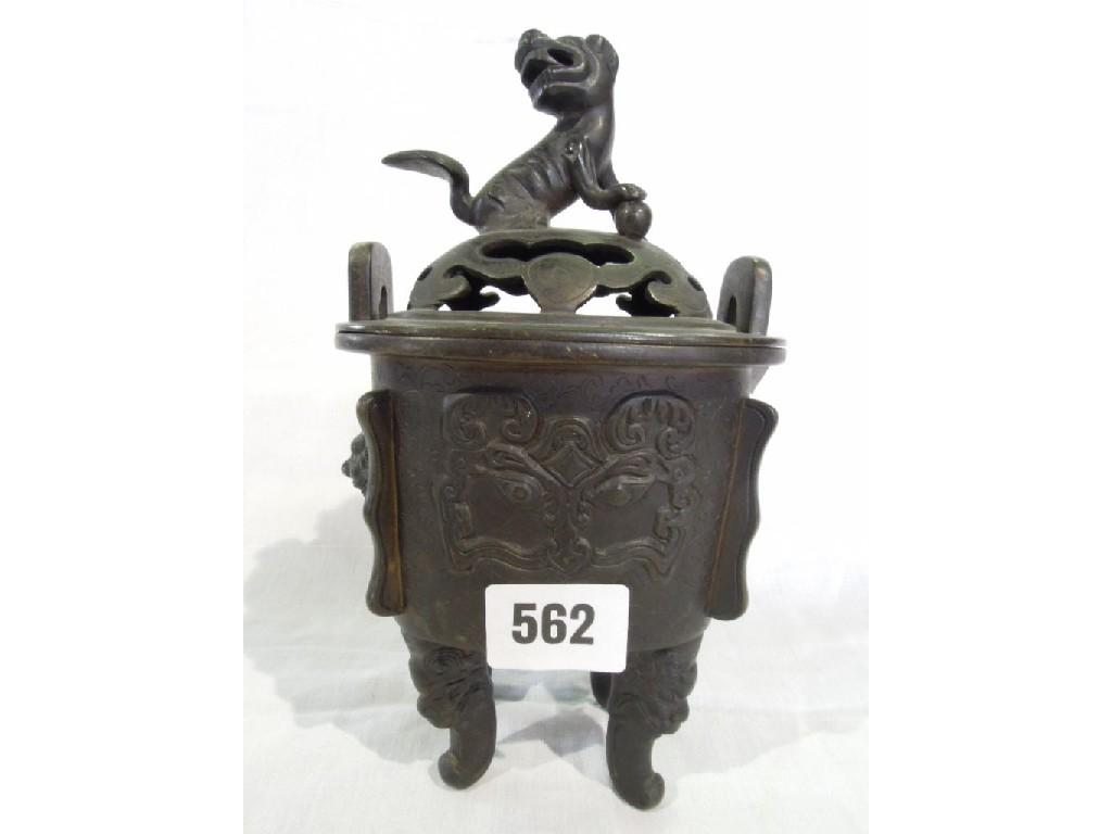 Appraisal: A Chinese bronze Koro with a lion dog to the