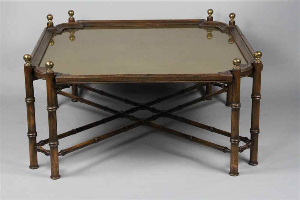 Appraisal: COFFEE TABLE WITH BRASS TOP INSERT having conforming molding the