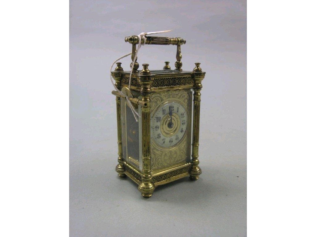 Appraisal: A brass carriage clock with enamelled chapter ring within engraved